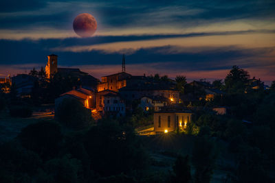 High angle view of illuminated buildings in town at night