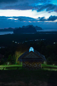 Built structure on mountain against sky at night