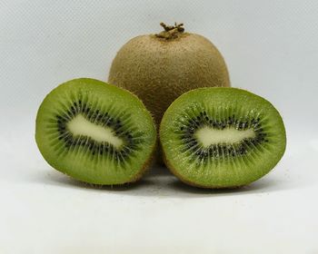 Close-up of fruits against white background