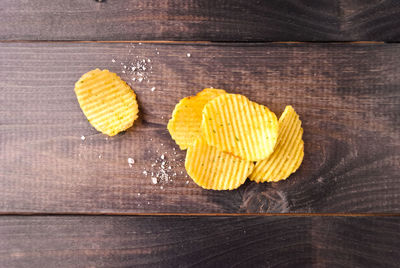 High angle view of yellow slices on table