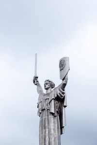 Low angle view of statue against sky