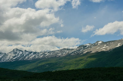 Scenic view of snowcapped mountains against sky