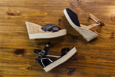 High angle view of shoes on wooden table
