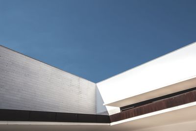 Low angle view of building against clear blue sky