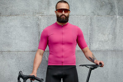 Portrait of young man riding bicycle