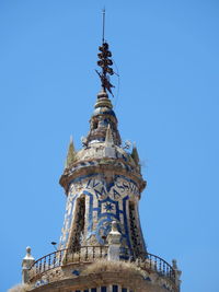 Low angle view of church steeple in Écija, southern spain, against clear sky