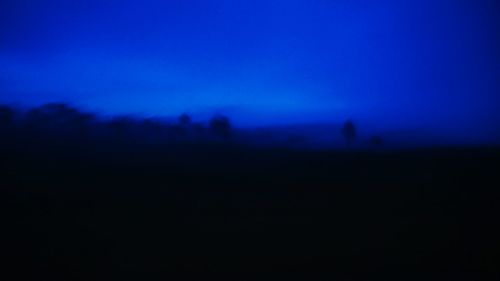 Scenic view of landscape against blue sky