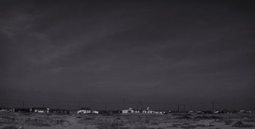 People on beach against sky