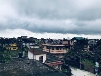 High angle view of buildings in city against sky