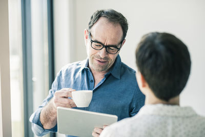 Businessman with tablet and businesswoman