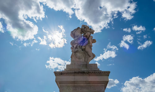 Low angle view of statue against sky