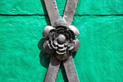Close-up of padlocks hanging on metal door