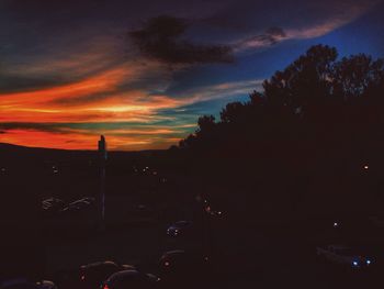 Silhouette trees against sky during sunset