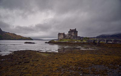 Panoramic view of sea and buildings against sky