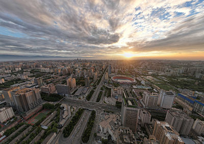 High angle view of city buildings during sunset