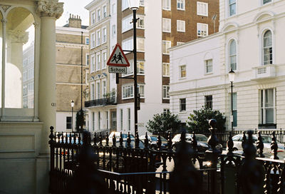 Flags on city against sky