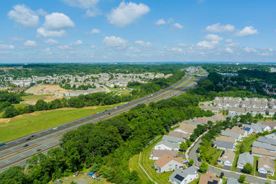 High angle view of buildings in city against sky