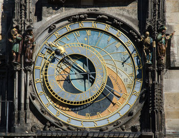 Close-up of clock tower against building