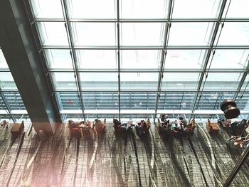 High angle view of people sitting at airport