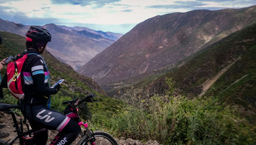 Man riding bicycle on mountain