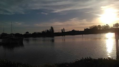 Scenic view of lake at sunset