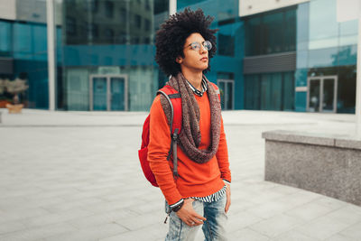 Thoughtful young man standing on street