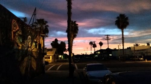 Cars on road at sunset