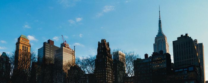 Low angle view of skyscrapers against sky