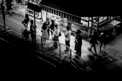 High angle view of people walking on bridge at night