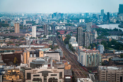 High angle view of buildings in city against sky