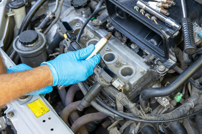 Car spark plug replacement. repairing of vehicle.