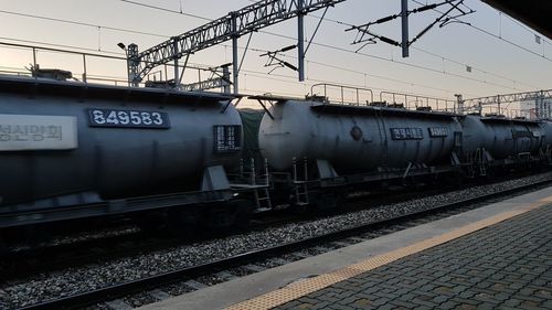 Train at railroad station against sky