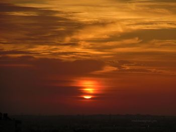 Scenic view of dramatic sky during sunset