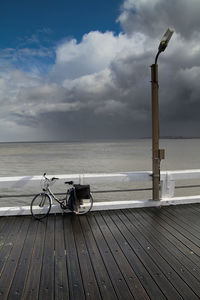 Scenic view of sea against cloudy sky