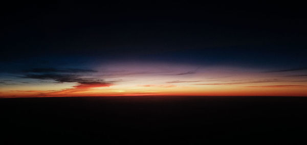 Scenic view of dramatic sky during sunset