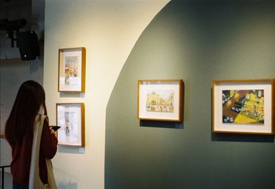 Woman photographing at home