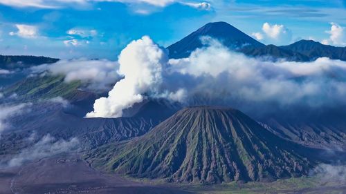 Panoramic view of volcanic landscape against cloudy sky