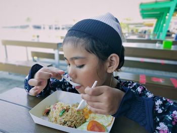 Portrait of woman eating food