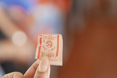 Close-up of woman holding paper