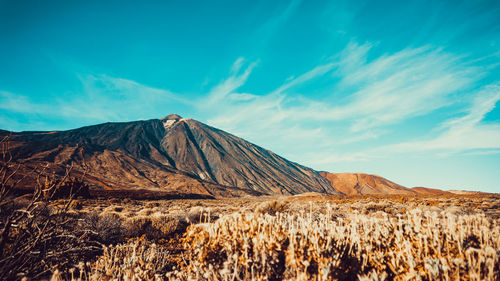 Panoramic view of arid landscape against sky