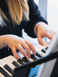 Hands of a person playing the piano