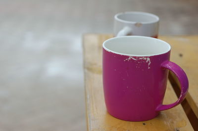 Close-up of coffee cups on table