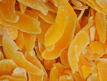 Full frame shot of dried mango slices for sale at market