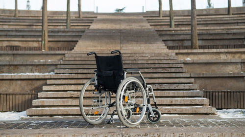 Rear view of man walking on staircase