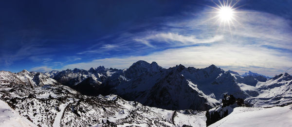 Scenic view of snowcapped mountains against sky