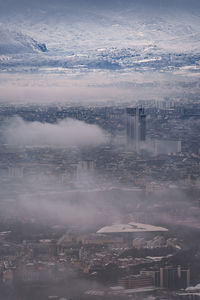 High angle view of buildings in city against sky