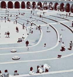 People enjoying at old amphitheater in city