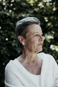 Portrait of man looking away outdoors