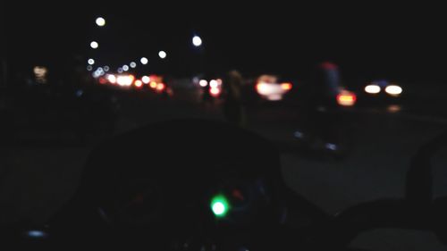 Defocused image of car in city at night