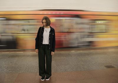 Blurred motion of train at railroad station